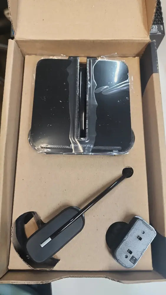 Plantronics Poly CS540 wireless headset and charging base in cardboard box