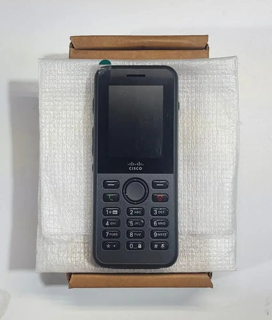 Cisco 8821 wireless IP phone refurbished, placed on white packaging and a cardboard box