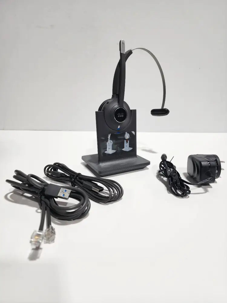 Cisco 561 wireless mono headset with charging base and cables on white background