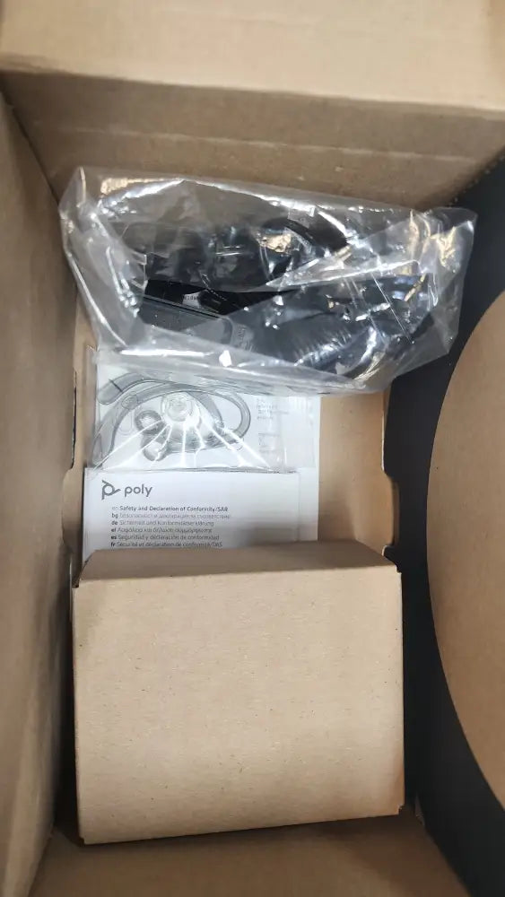 Plantronics Poly CS540 wireless headset in sealed plastic, box with user manual visible