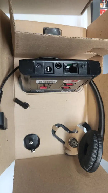 Plantronics Poly CS540 wireless headset and charging base in cardboard packaging