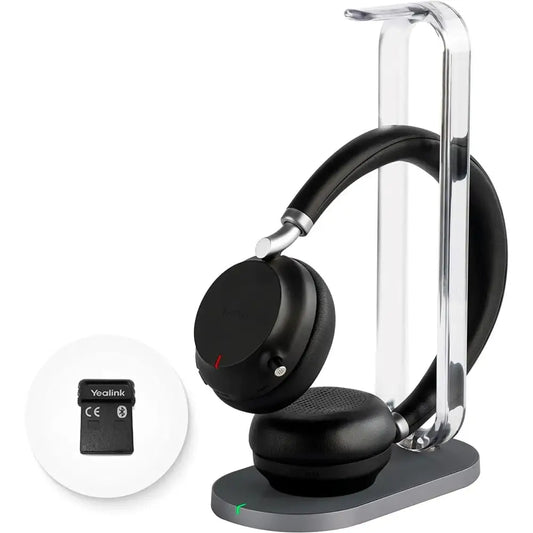 Yealink BH72 Lite black Bluetooth headset on charging station with USB-A dongle