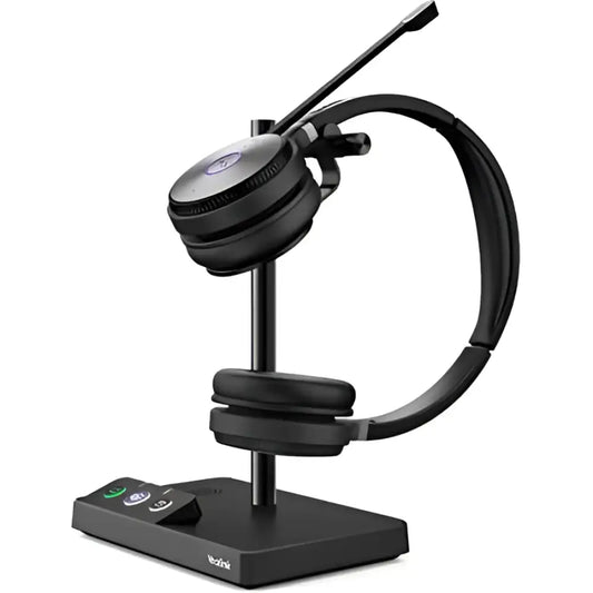 Yealink WH62 dual DECT wireless headset on charging base with microphone
